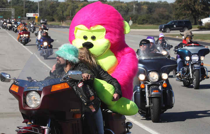 More than 2,800 motorcyclist participated in the 40th annual Highway Hikers Toy Run. The motorcycles stretched out across Clark County as they made their way from Medway to the Clark County Fairgrounds with toys and money for the Salvation Army of Clark County's Christmas for needy children.   (Bill Lackey / Springfield News-Sun)